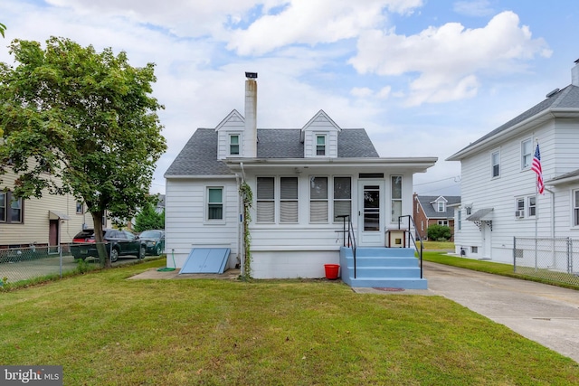 view of front of home with a front yard