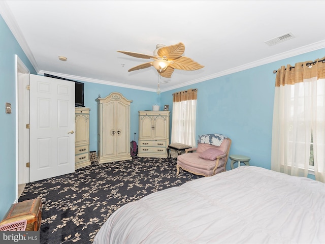 carpeted bedroom featuring ornamental molding and ceiling fan