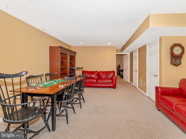 view of carpeted dining area