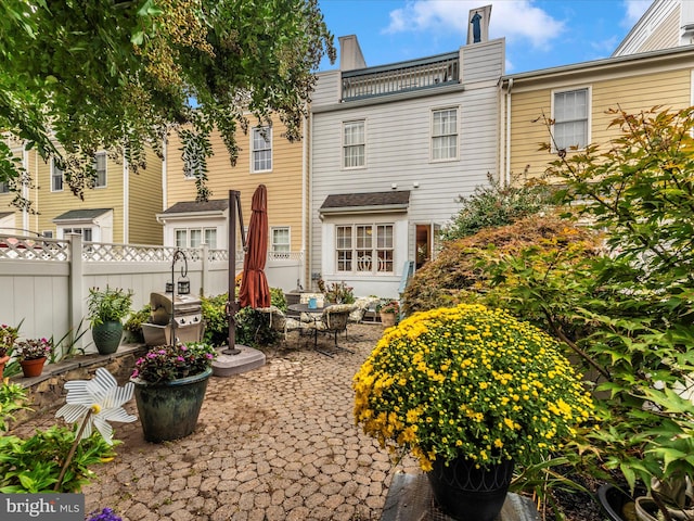 back of property featuring a patio area