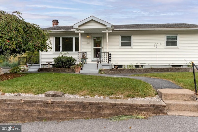 view of front of house with a front lawn