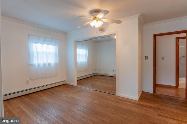 empty room featuring ceiling fan, a baseboard radiator, light wood-type flooring, and ornamental molding