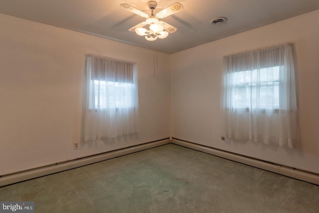 carpeted spare room with ceiling fan and baseboard heating