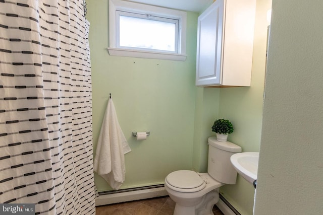 bathroom with tile patterned flooring, toilet, a baseboard heating unit, and curtained shower