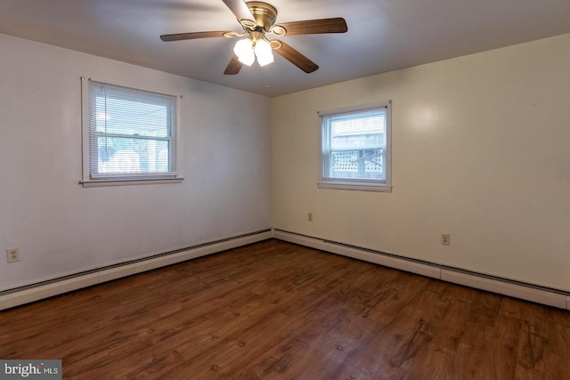 empty room featuring dark hardwood / wood-style flooring and ceiling fan