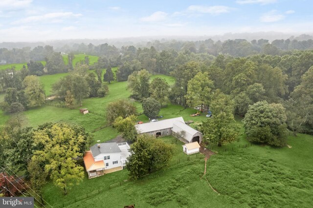 birds eye view of property with a rural view