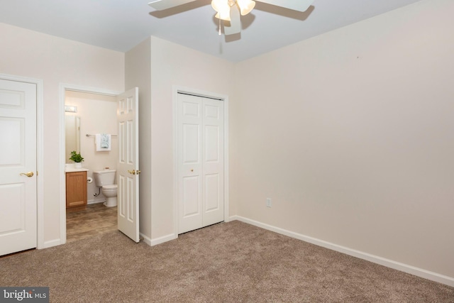 unfurnished bedroom with ceiling fan and light colored carpet