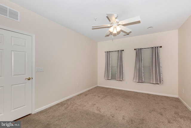 carpeted empty room with ceiling fan