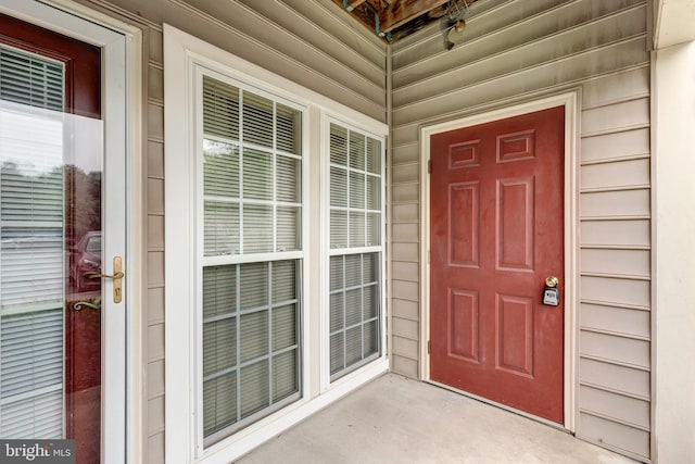 doorway to property featuring covered porch