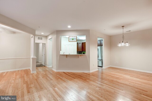 unfurnished room with a healthy amount of sunlight, hardwood / wood-style floors, and ceiling fan