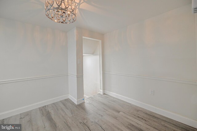 additional living space featuring lofted ceiling and light carpet