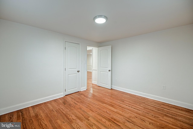 unfurnished room with light hardwood / wood-style flooring