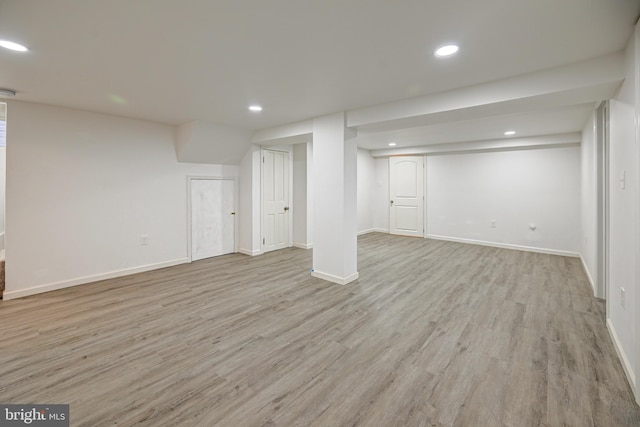 basement featuring light wood-type flooring