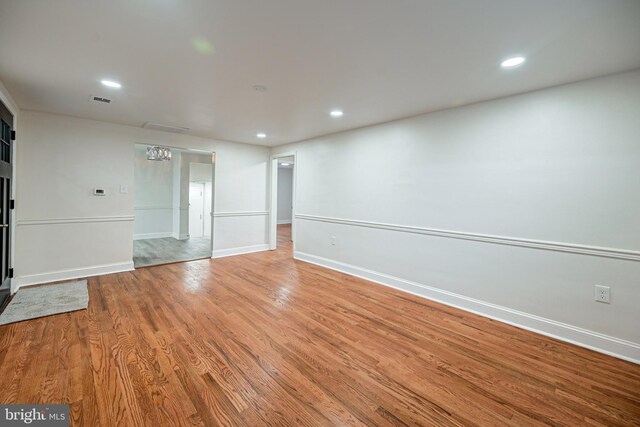 kitchen with white cabinets, appliances with stainless steel finishes, sink, and light hardwood / wood-style flooring