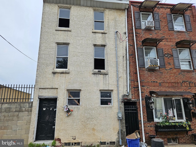 view of front of home with cooling unit