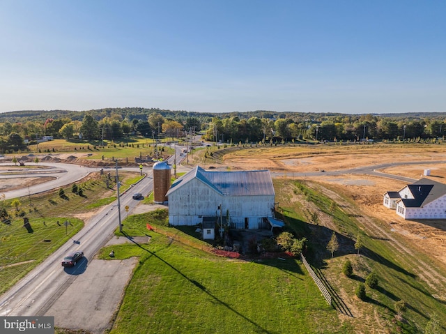 birds eye view of property featuring a rural view