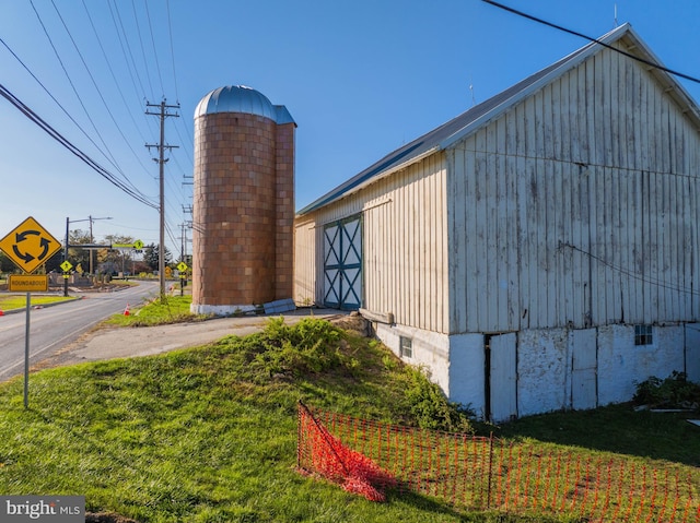 view of home's exterior with a lawn