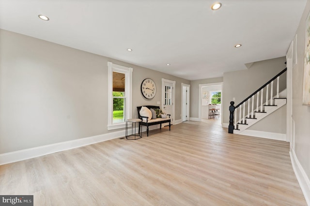 entrance foyer featuring light wood-type flooring and plenty of natural light