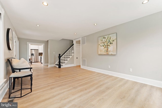 sitting room with light hardwood / wood-style floors