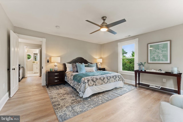 bedroom with ceiling fan and light hardwood / wood-style flooring