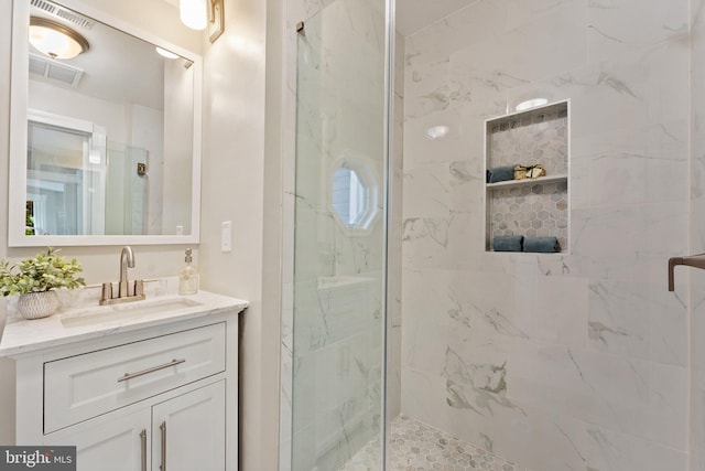 bathroom with vanity and an enclosed shower