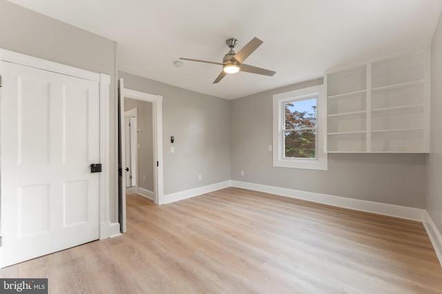 unfurnished bedroom with ceiling fan, a closet, and light hardwood / wood-style floors