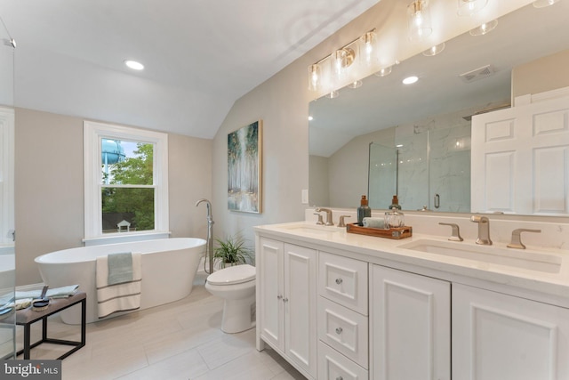 full bathroom featuring vanity, lofted ceiling, toilet, shower with separate bathtub, and tile patterned flooring