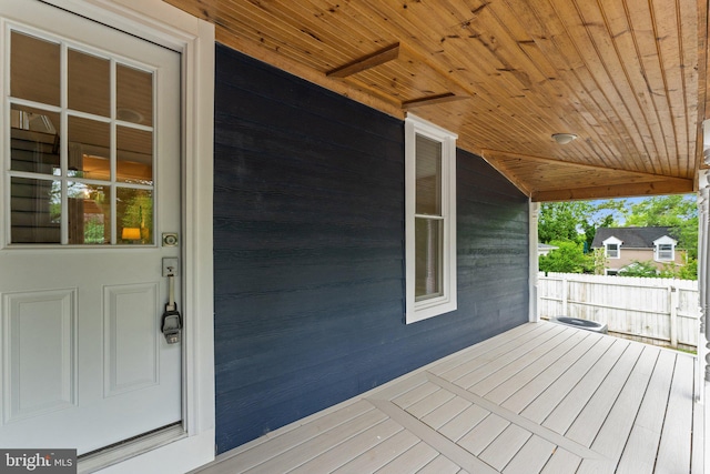 wooden deck featuring covered porch