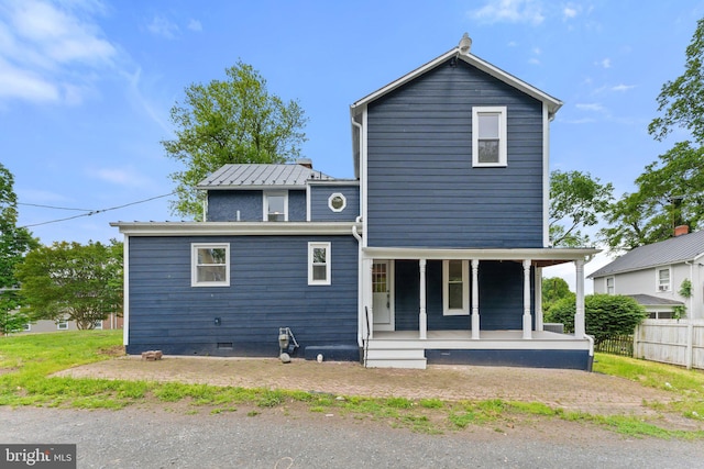 back of property featuring a porch