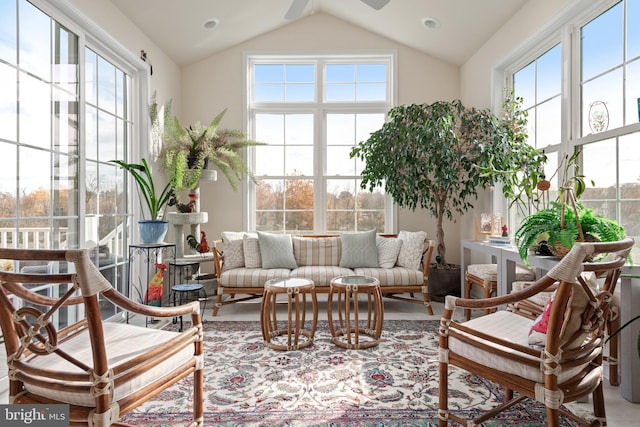 sunroom / solarium featuring lofted ceiling and ceiling fan