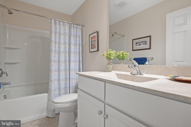 full bathroom featuring vanity, toilet, tile patterned floors, and shower / tub combo