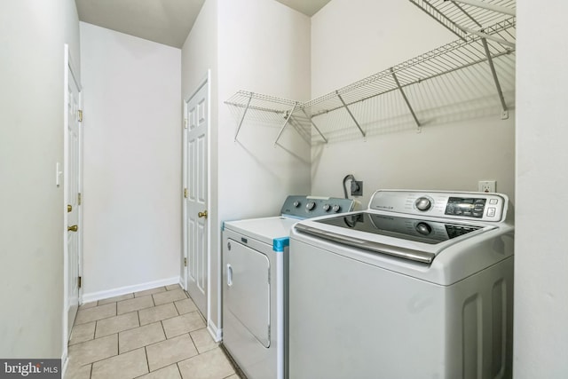 washroom featuring washer and clothes dryer