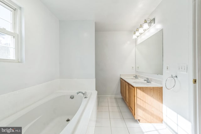 bathroom with vanity, tiled bath, and tile patterned floors