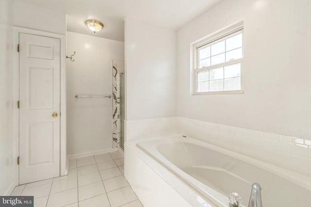 bathroom featuring plus walk in shower and tile patterned flooring