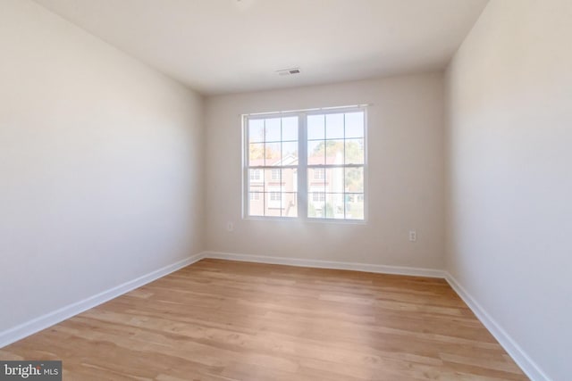 unfurnished room with light hardwood / wood-style floors