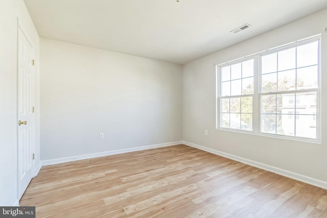 unfurnished room featuring light hardwood / wood-style flooring