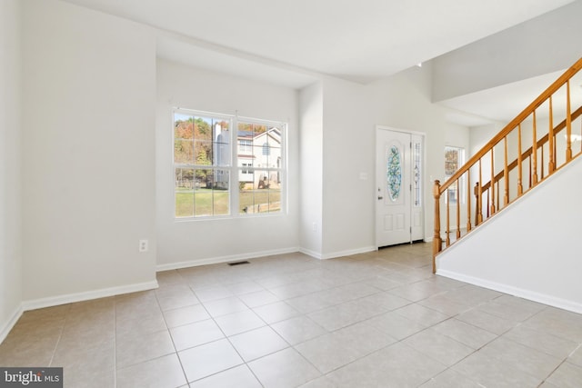 foyer with light tile patterned flooring