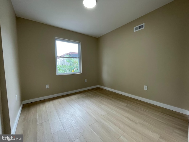 unfurnished room with light hardwood / wood-style flooring