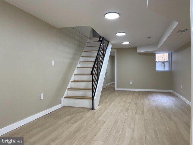 stairs with wood-type flooring