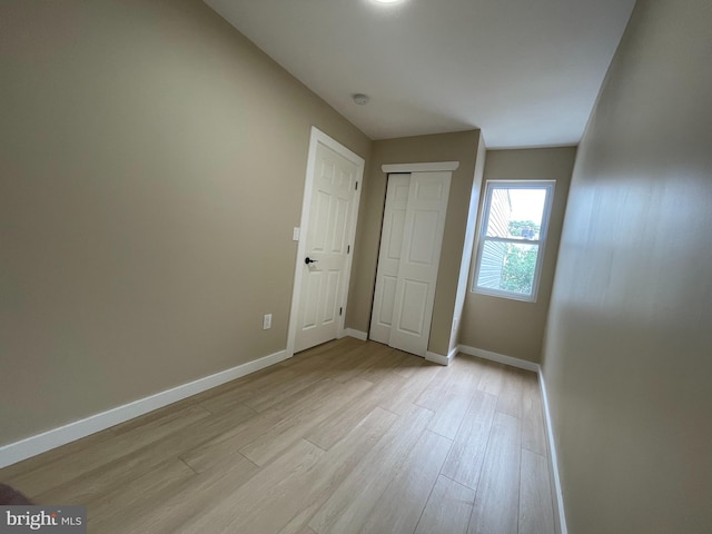 unfurnished room featuring light wood-type flooring