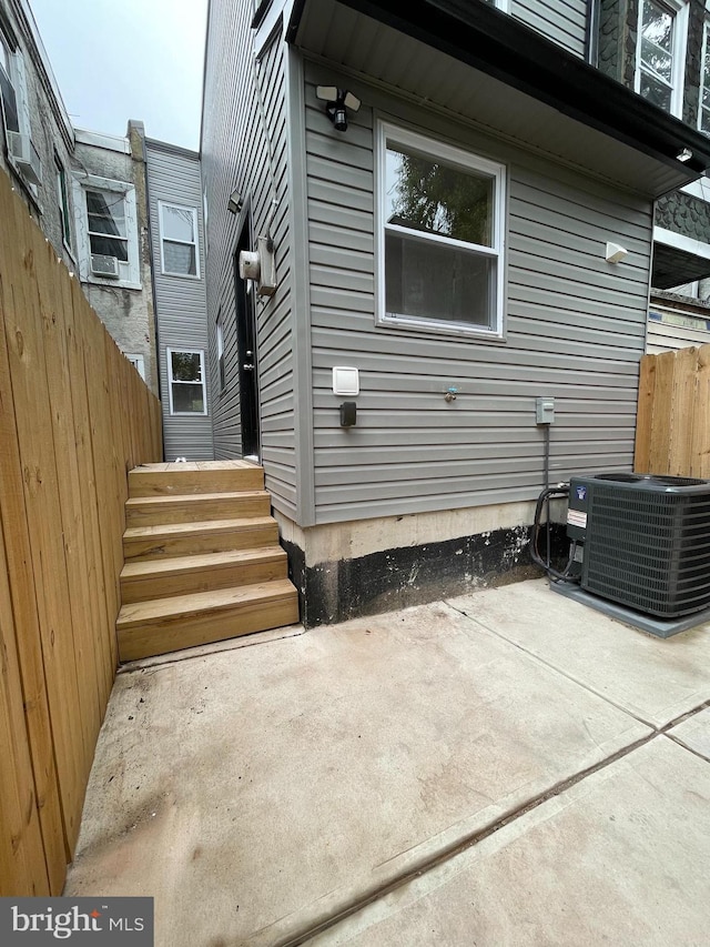 exterior space featuring a patio and central AC