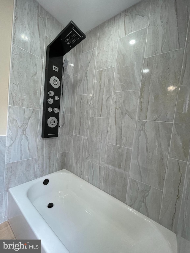 bathroom featuring separate shower and tub and tile walls