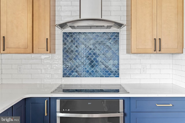 kitchen featuring oven, backsplash, black electric cooktop, and extractor fan