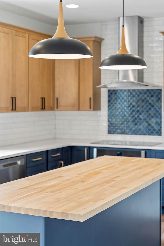 kitchen featuring a center island, butcher block counters, and decorative backsplash