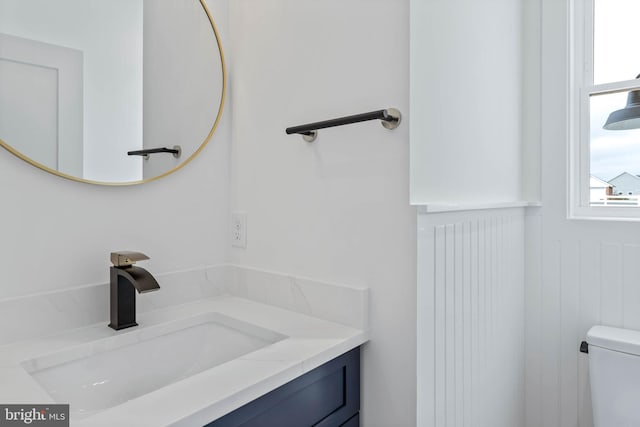 bathroom with vanity and toilet