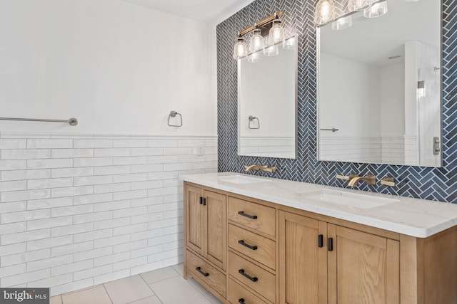 bathroom featuring vanity, tile walls, and tile patterned flooring