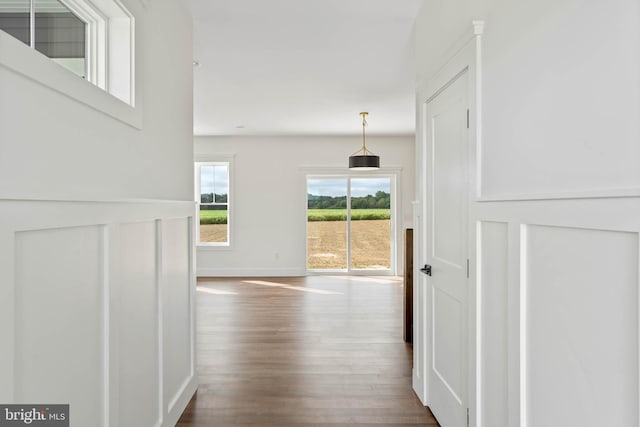 hall with dark hardwood / wood-style floors