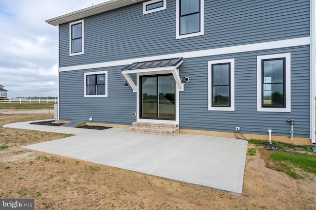 back of house with a patio area