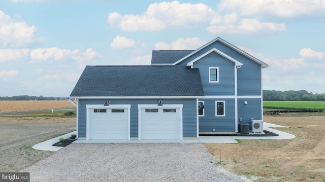 front facade featuring a rural view and central AC