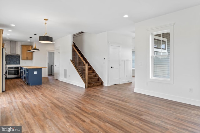 unfurnished living room with dark hardwood / wood-style flooring